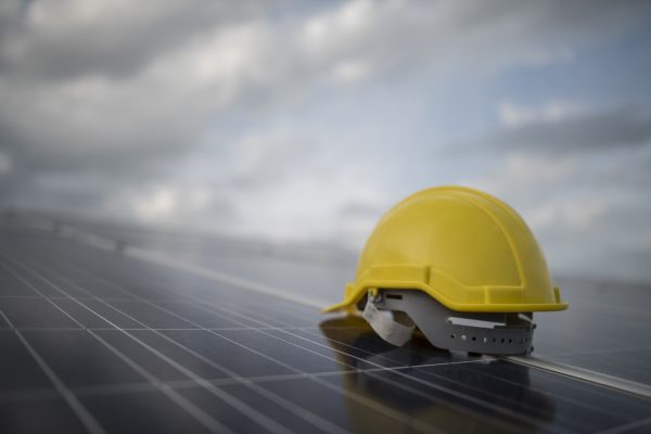 yellow-safety-helmet-on-solar-cell-panel.jpg